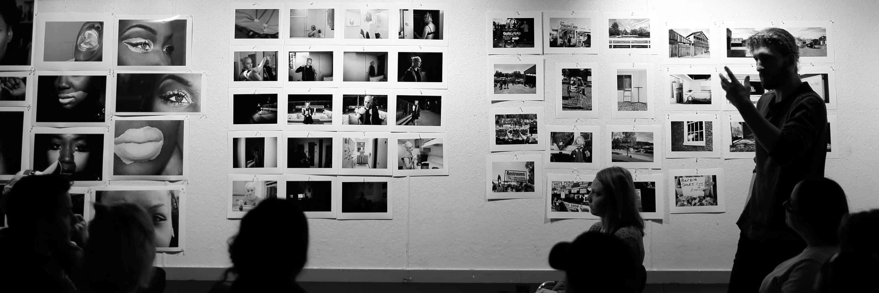 A wall of black and white photos