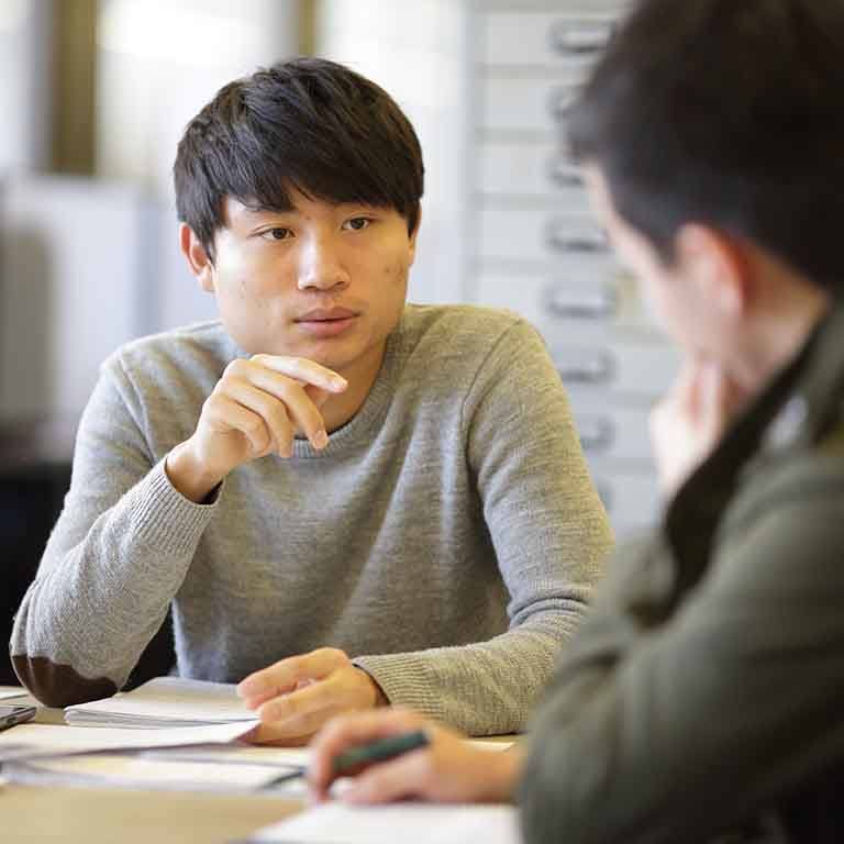 Two students have a conversation.