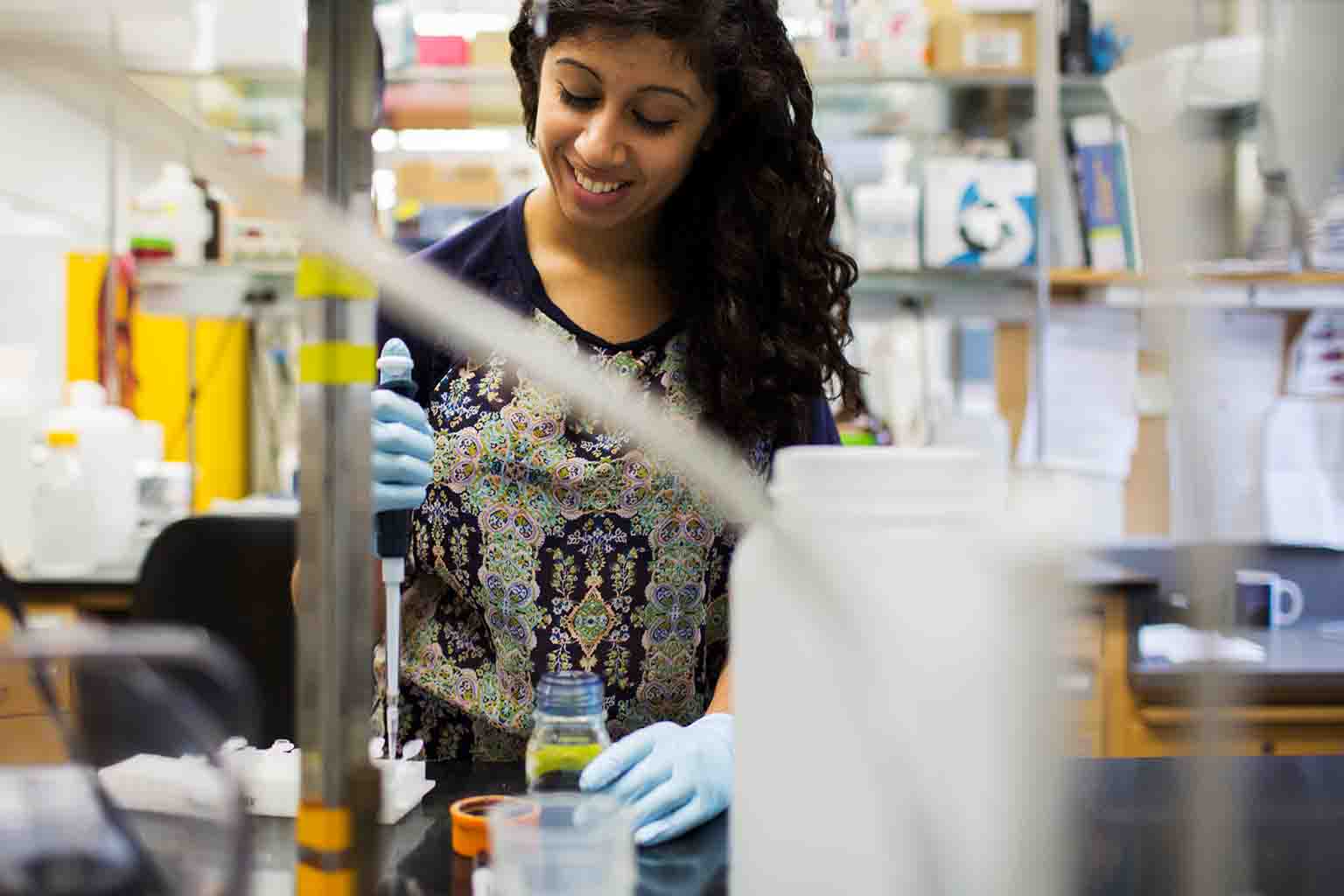 A student performs research in a lab.