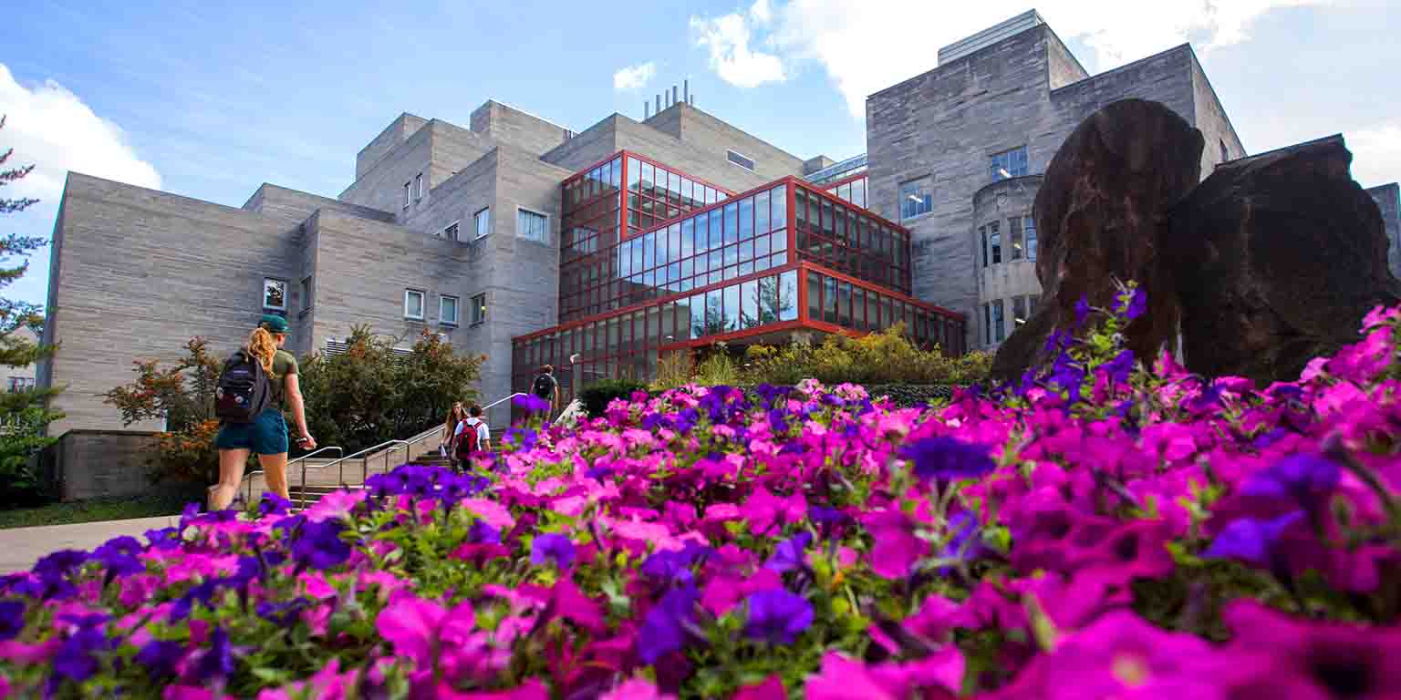 A bed of flowers, with the Biology Building in the background