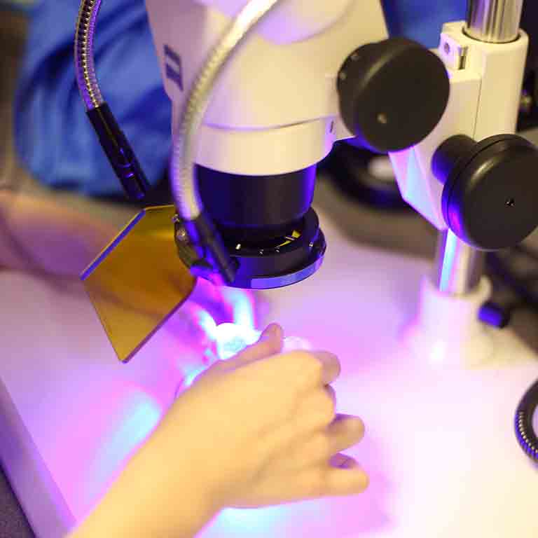 A student works with high-tech lab equipment.